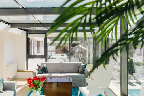 a living room with a couch and a table at Krolo Villa&Wine in Trilj