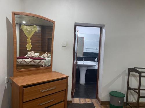 Postel nebo postele na pokoji v ubytování Ella My Inn
