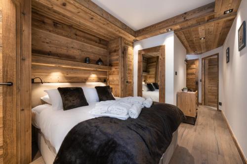 Ένα ή περισσότερα κρεβάτια σε δωμάτιο στο Alaska Lodge by Alpine Resorts