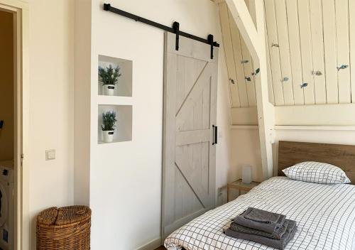 Postel nebo postele na pokoji v ubytování aan Hooger Wal
