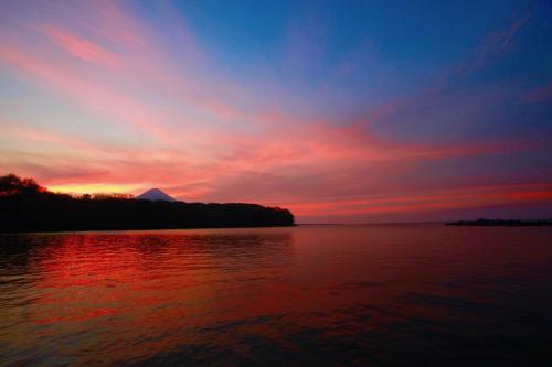 a sunset over a body of water at El Pital, Chocolate Paradise in Balgue