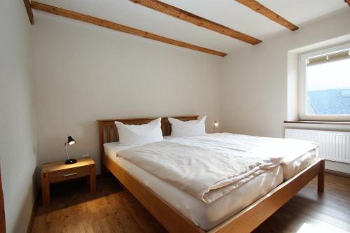 מיטה או מיטות בחדר ב-Gasthaus Pension Geimer