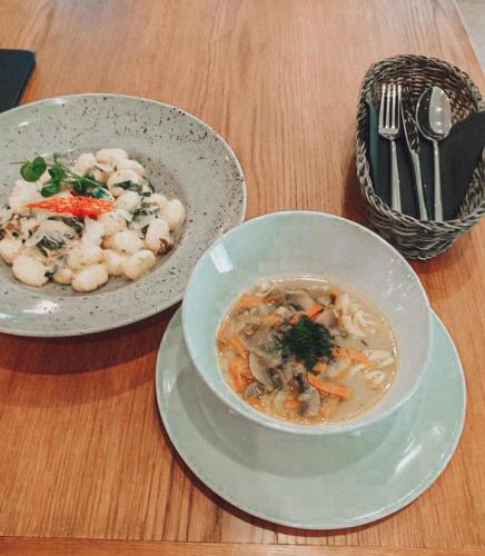 a bowl of soup and a bowl of shrimp on a table at Stylowa Kolbuszowa in Kolbuszowa