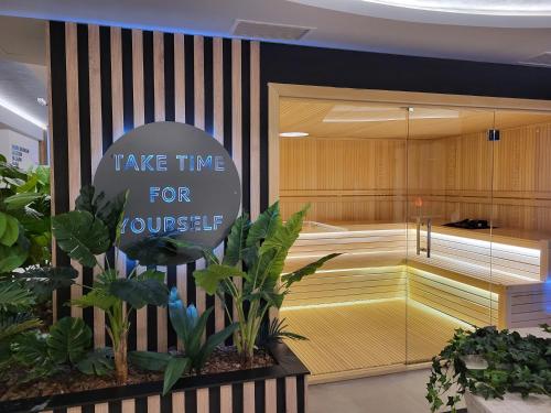 a store with a sign that says take time for yourself at Boškovići 52 in Palisad