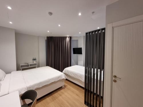 Postel nebo postele na pokoji v ubytování 10m2 Hotel
