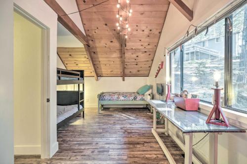 a room with a bunk bed and wooden ceilings at Walk Downtown Arnold Cabin with Large Deck! in Arnold