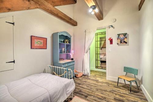 a bedroom with a bed and a desk in it at Walk Downtown Arnold Cabin with Large Deck! in Arnold