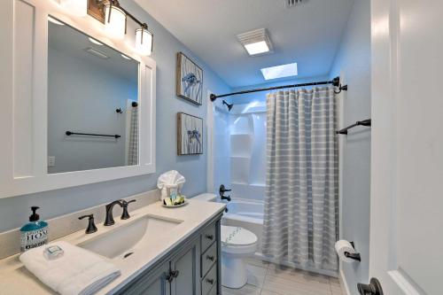 a bathroom with a sink and a toilet and a shower at Updated Waterfront Escape with Dock and Fire Pit in Pensacola
