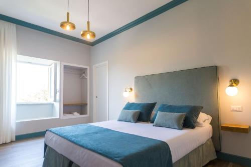 Postel nebo postele na pokoji v ubytování Sorrento Pool&Suites