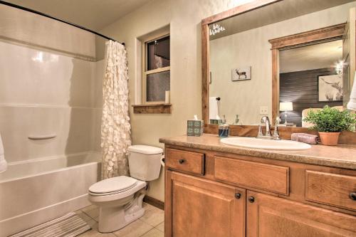 a bathroom with a toilet and a sink and a shower at Townhome with Private Hot Tub, 8 Mi to Downtown in Bozeman