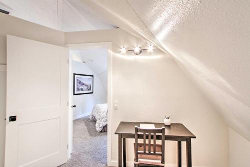 a dining room with a table and two chairs at Geodesic Dome House with Scenic Views and Hot Tub in Eatonville