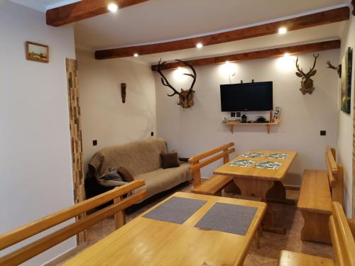 a living room with a couch and a table at Agroturystyka u Marii in Komańcza