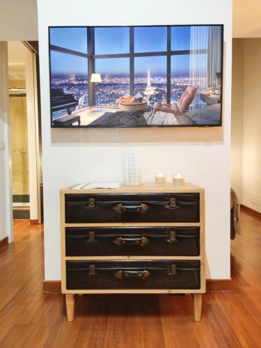 a dresser with a tv on top of it at Pantheon Grand Suite in Rome