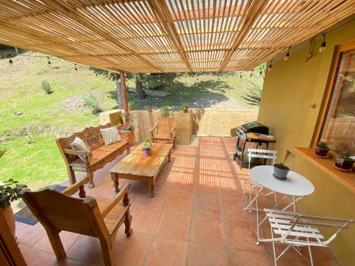 an outdoor patio with a table and chairs and a table and chairsktop at Casas del Viento in Villa de Leyva