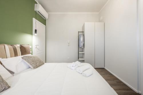 Postel nebo postele na pokoji v ubytování Cucchiari Suite 4B