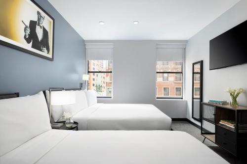 Cama o camas de una habitación en OYO Times Square