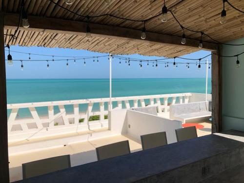 a room with a view of the beach at Playa 55 beach escape - adults only Guesthouse in Celestún