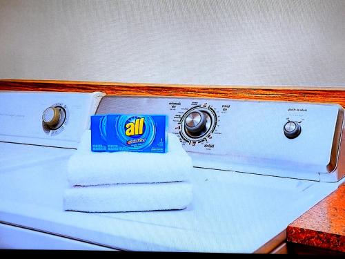 a pile of towels sitting on top of a stove at Days Inn by Wyndham Camp Verde Arizona in Camp Verde