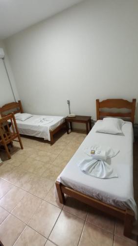 Ein Bett oder Betten in einem Zimmer der Unterkunft Hotel Sao Nicolau