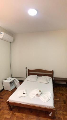 Ein Bett oder Betten in einem Zimmer der Unterkunft Hotel Sao Nicolau