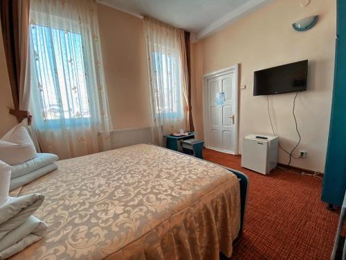 Postel nebo postele na pokoji v ubytování Hotel Belvedere