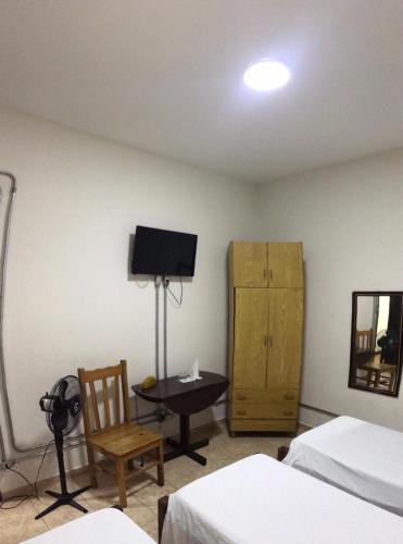 Ein Bett oder Betten in einem Zimmer der Unterkunft Hotel Sao Nicolau