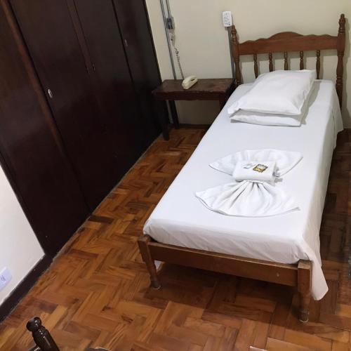 Ein Bett oder Betten in einem Zimmer der Unterkunft Hotel Sao Nicolau