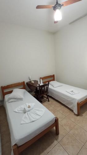 Ein Bett oder Betten in einem Zimmer der Unterkunft Hotel Sao Nicolau
