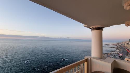 a view of the ocean from a balcony at Alex sea view apartment - families only in Alexandria