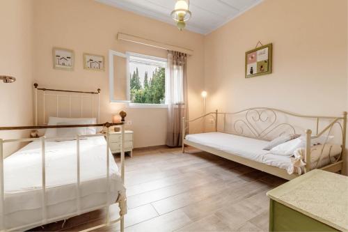 Ένα ή περισσότερα κρεβάτια σε δωμάτιο στο Pezouli, the real nature and village taste