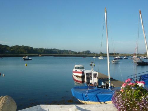 a group of boats docked in a harbor at 3 Harbour Strand in Bembridge