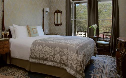 a bedroom with a large bed and a window at Monte Cristo Bed and Breakfast in San Francisco