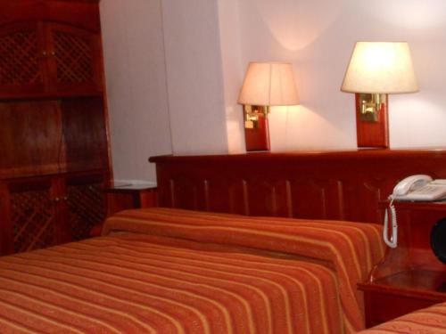 A bed or beds in a room at Portal de Salta