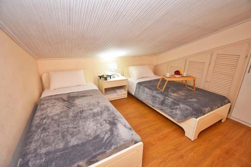 מיטה או מיטות בחדר ב-Gouvia - Luxury Suite