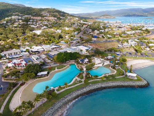 an aerial view of the resort and the beach at Pina Mimosa - Airlie Beach in Airlie Beach