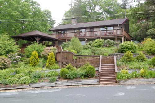a house with a garden in front of it at Cliff Dwellers Inn in Blowing Rock