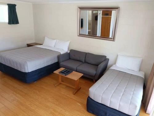 Postel nebo postele na pokoji v ubytování Astral Motel