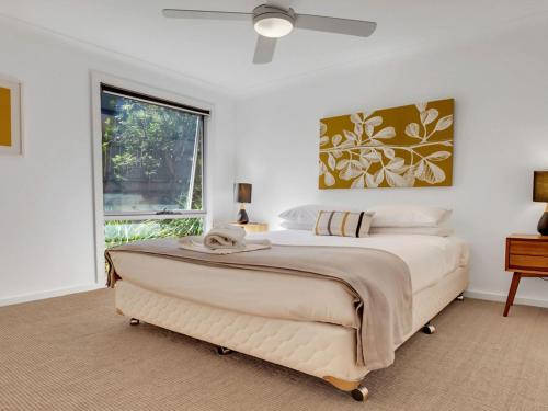 Postel nebo postele na pokoji v ubytování Sunshine Beach House