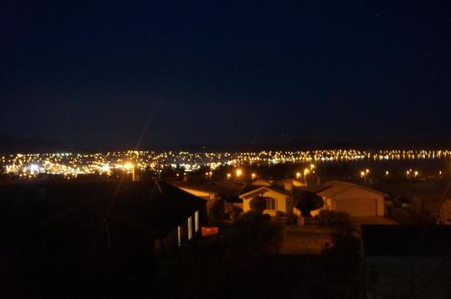 a view of a city lit up at night at Punawai Homestay in Taupo