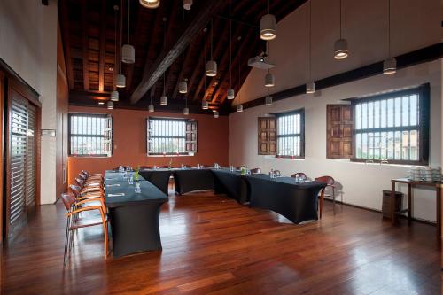 a large room with tables and chairs in it at Sofitel Legend Santa Clara Cartagena in Cartagena de Indias