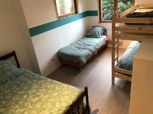 Ένα ή περισσότερα κρεβάτια σε δωμάτιο στο Le Domaine Des Zoiseaux - LDDZ des Flandres