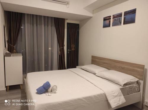 Ein Bett oder Betten in einem Zimmer der Unterkunft SleepRest @ Pollux Habibie