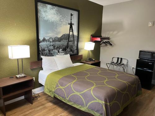 a hotel room with a bed and two lamps at Super 8 by Wyndham San Antonio Near Fort Sam Houston in San Antonio