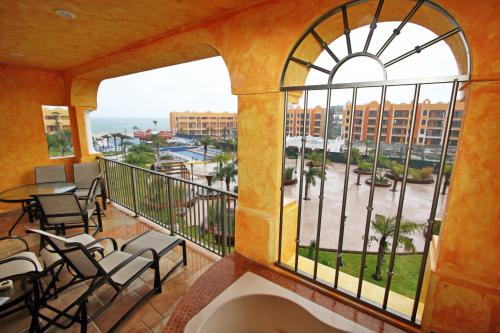 a balcony with a view of the ocean at The Royal Haciendas Resort & Spa in Playa del Carmen