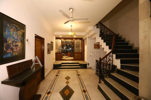 a hallway with stairs and a ceiling at Hotel Ambica Palace AIIMS New Delhi - Couple Friendly Local ID Accepted in New Delhi