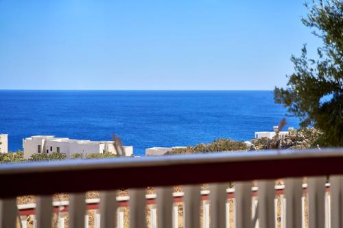 a view of the ocean from a balcony at Amore Kastellia-Althea Homes in Amoopi