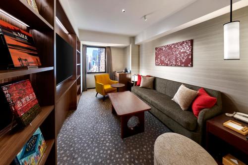 a living room filled with furniture and a couch at Shiba Park Hotel in Tokyo