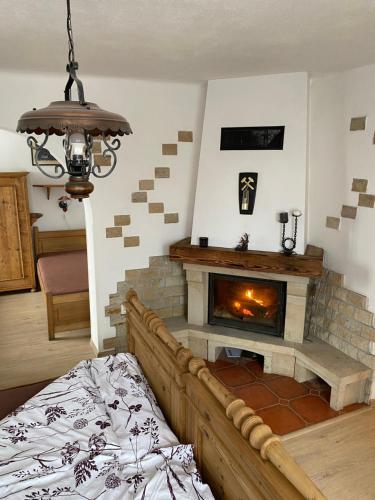 a bedroom with a fireplace and a bed in a room at Penzio Ostrava in Ostrava