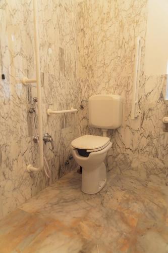 a bathroom with a white toilet in a room at Agriturismo Tripala in Minucciano