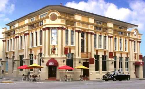 a building with a car parked in front of it at The County Hotel in Napier